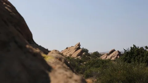 Slider over desert rocks, large outcrop in BG Video stock 90072634