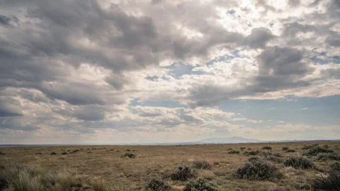 Slider pan clouds across desert landscape Wyoming Stock Footage 167446309