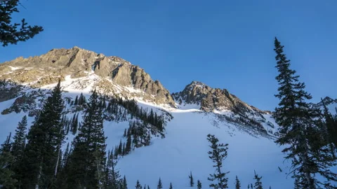Slider pan mountain peak in winter sunset shadow Stock Footage 167055830