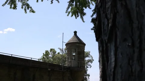 Slider Reveal of Guard Tower on Old Penitentiary - Shallow Depth of Field Stock Footage 246123053