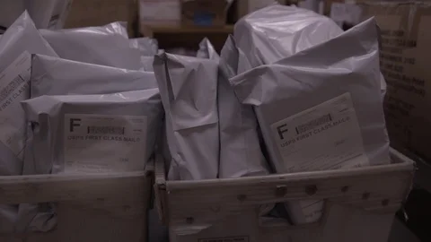 Slider Shot Boxes Of USPS Packages To Ship Out At Fulfillment Center Stock Footage 87874560