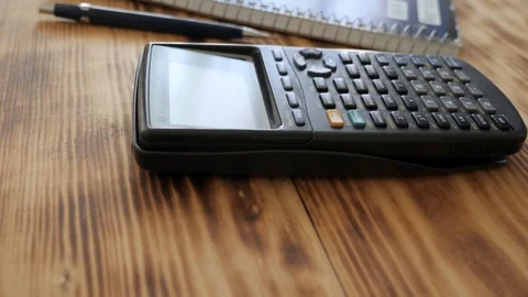 A slider shot of calculator, notebook, coffee mug, and pencil 2 Video stock 94015405
