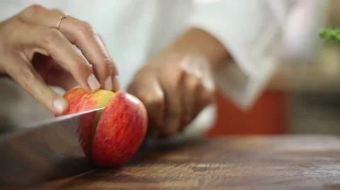 Slider Shot - Chef cutting an apple with knife skills Stock Footage 59888480