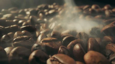 Slider shot of coffee beans during roasting. Dark roasted coffee beans with Video stock 238597544