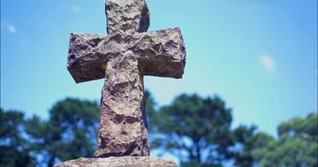 Slider shot of cross head stone in an old cemetery Video stock 85833764