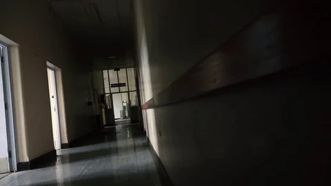 Slider shot down hospital hallway Stock Footage