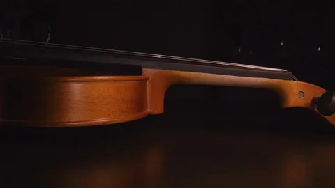 Slider shot down the side of a violin. Slide from the neck down to the Stock-Footage 120820070