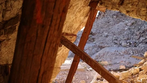 Slider Shot Looking Out from Inside Abandoned Mine - Shallow Depth of Field Stock Footage 246192330