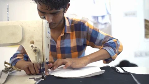 Slider Shot Of Man Tailor Working On Sewing Machine. Stock Footage 113078302