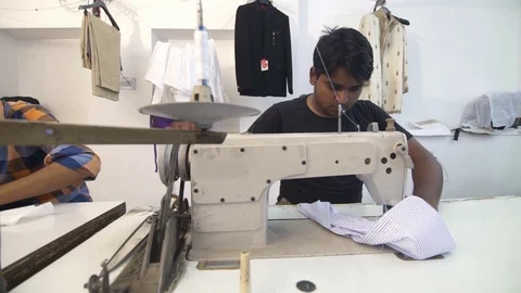 Slider Shot Of Man Tailor Working On Sewing Machine. Stock Footage 113078369