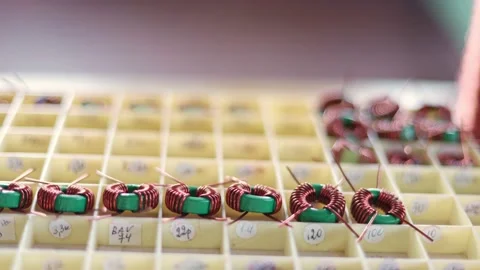 Slider shot of a many twisted copper coils lie Stock Footage 152925464