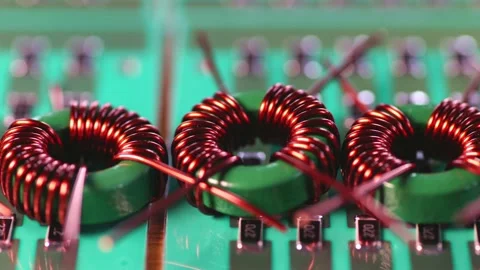 Slider shot of a many twisted copper coils lie Stock Footage 152981391