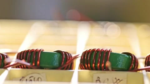 Slider shot of a many twisted copper coils lie Stock Footage 153153671