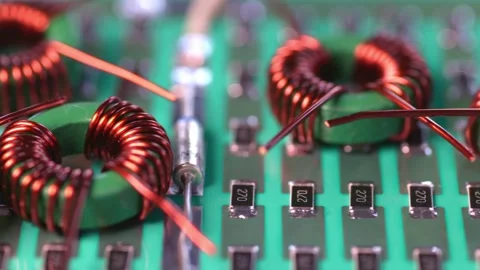 Slider shot of a many twisted copper coils lie Stock Footage 153153878