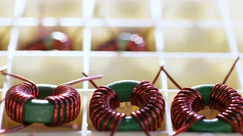 Slider shot of a many twisted copper coils lie Stock Footage 153305461