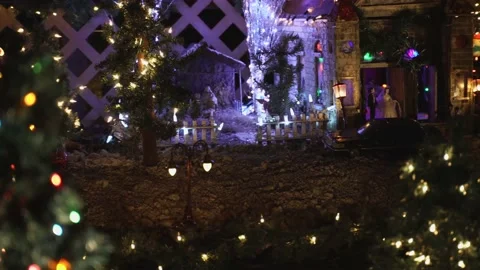 Slider shot of model train village at night revealing Nativity scene Stock Footage 148796543