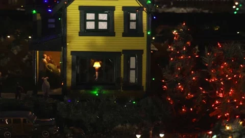 Slider shot of model train village at night revealing  house from Christmas Stock Footage 149088327