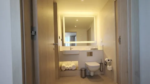 Slider shot of Modern Tiled Bathroom with Shower in modern real estate interior Stock Footage 257695418