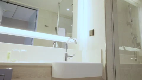 Slider shot of Modern Tiled Bathroom with Shower in modern real estate interior Video stock 257701934
