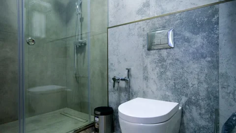 Slider shot of Modern Tiled Bathroom with Shower in modern home Video stock 307001440