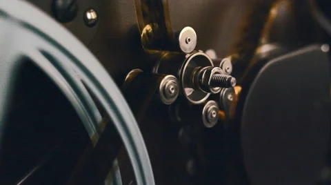 Slider shot of an old 16mm movie  projector transport gear Stock Footage