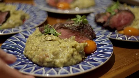 Slider shot of plates being served. Stock Footage