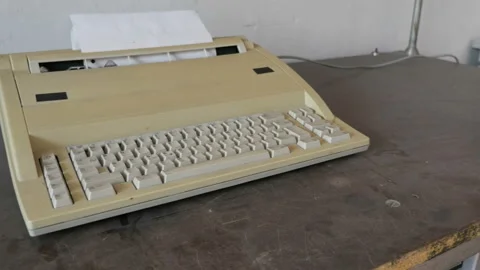 Slider Shot Of Retro Electrical Typewriter On The Dust Table. Stock Footage 129691002