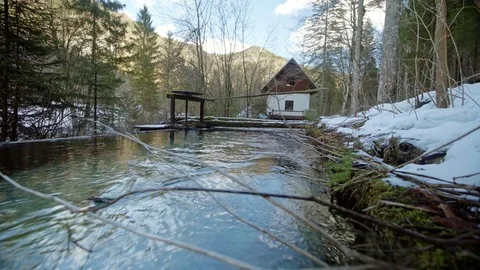 Slider shot of a river flowing to a private powerplant Stock Footage 85062406