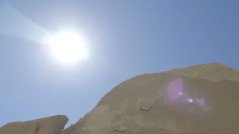 Slider Shot Sun Shining Down Over Sandstone Rock Mounds Video stock 121639432