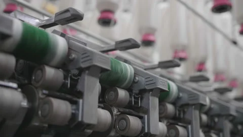 Slider Shot, Thread Wheels Spinning in Factory, Bangladesh Stock Footage 142030856