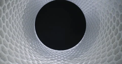 Slider shot through white modern honeycomb tunnel silo structure, 2 clips Video stock 154144886