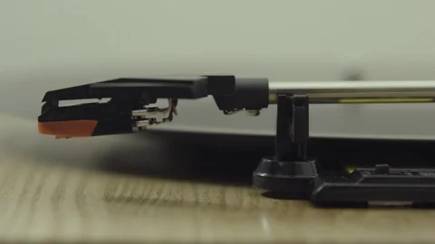 SLIDER SHOT OF TURNTABLE ARM BEING TAKEN OFF VINYL Stock Footage 126236196