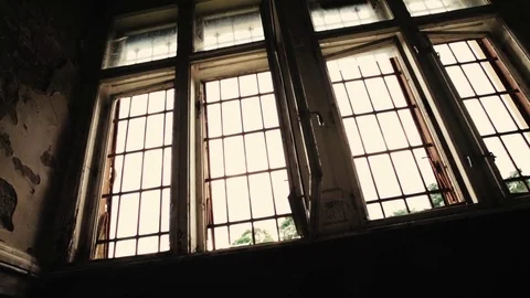 Slider shot of a window in an old abandoned, haunted building Stock Footage 81778429