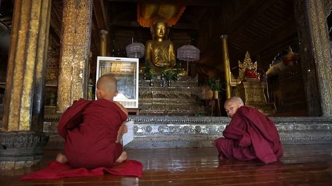 Slider shot of young monks learning in temple in Myanmar Stock Footage 104121911