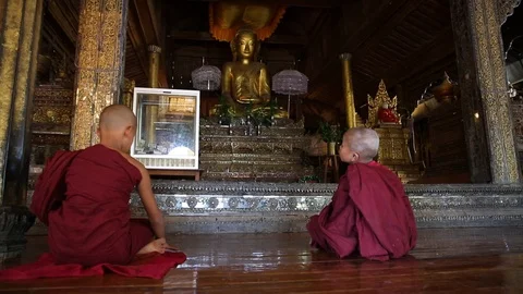 Slider shot of young monks learning in temple in Myanmar Stock Footage 104121931