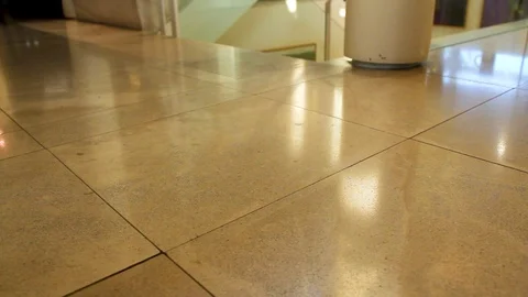Slider on tile floor in building Stock Footage 89482150