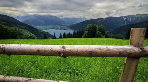 Slider time-lapse of austrian mountains, lake and stormy clouds Stock Footage 61407777