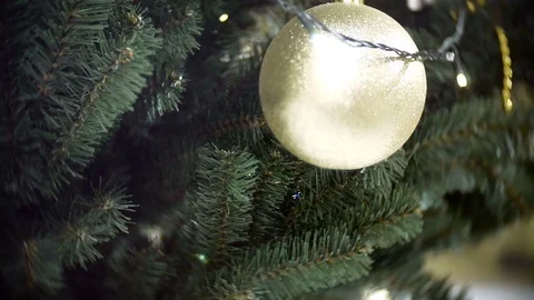 Slider view of big golden matte ball and lights. New Year's and abstract blurred 스톡 동영상 70661653