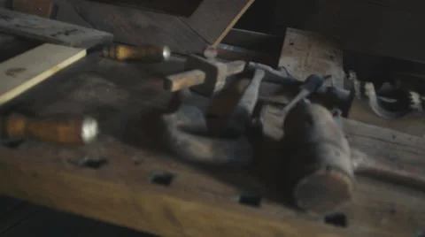 Slider/pan from wood tools to inside of corn mill. Stock Footage 39218137