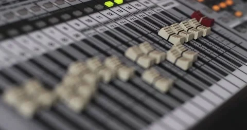 The sliders of the mixing sound console themselves move through the presets Stock Footage 177254943