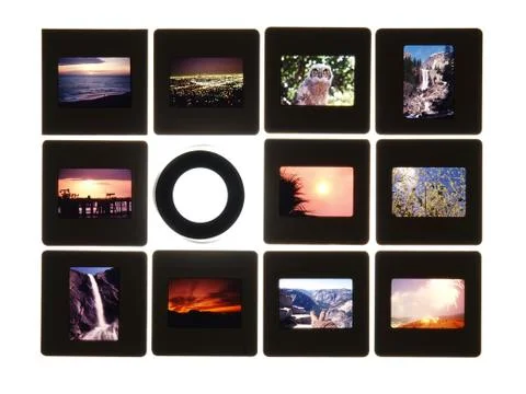 Slides and lupe on light table Stock Photos