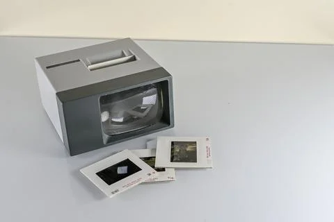 Slides scattered on a table and slide viewer Stock Photos