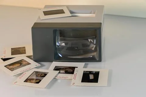 Slides scattered on a table and slide viewer Stock Photos