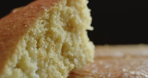 Sliding on baked cornbread cross section 4K video Stock Footage 249566591