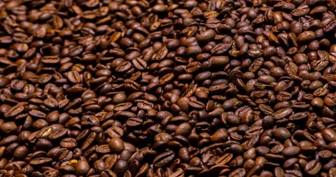 Sliding the camera close over a heap of coffee beans Stock Footage 131933502