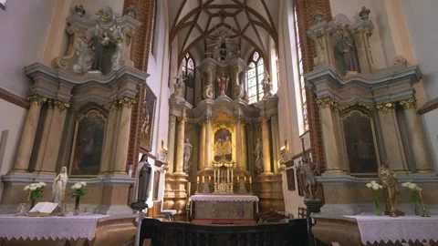 Sliding camera movement inside historic St. Anne's Church in Vilnius Old Town Stock Footage 334676463