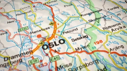 Sliding camera movement over road map focusing on Oslo, Norway. Video stock 332798394