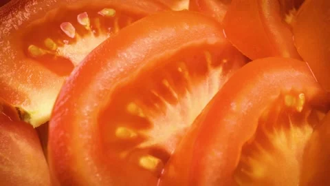 Sliding close-up shot of sliced tomatoes. 스톡 동영상 313833085