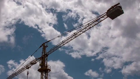 Sliding construction crane with clouds moving above HFR hyperlapse Video stock 132681505