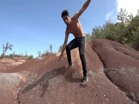 Sliding Down Red Dirt Dunes Stock Footage 80072300